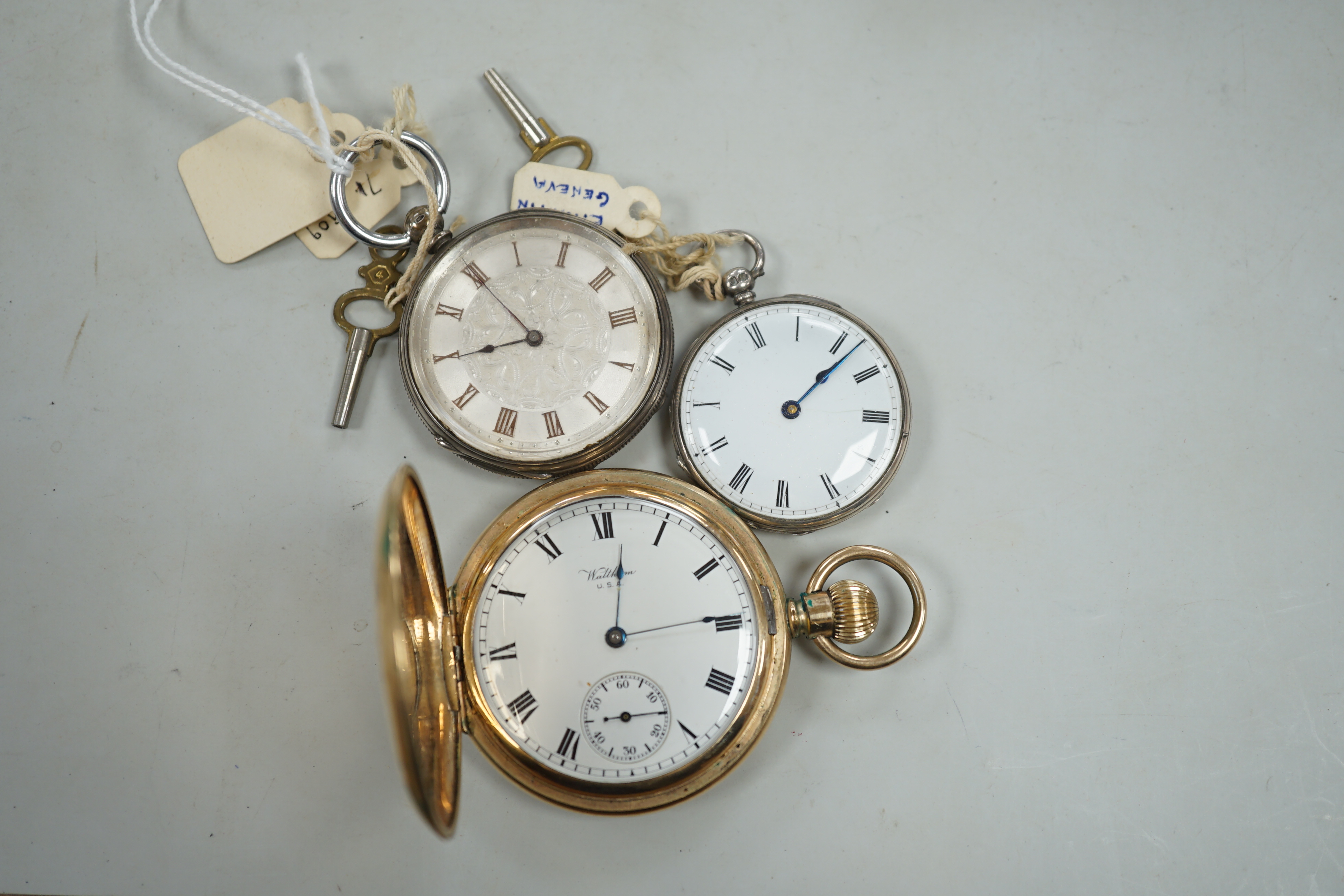 A Waltham gold plated hunter pocket watch and two fob watches, one silver.